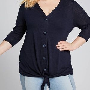 Button down light sweater. V neck.